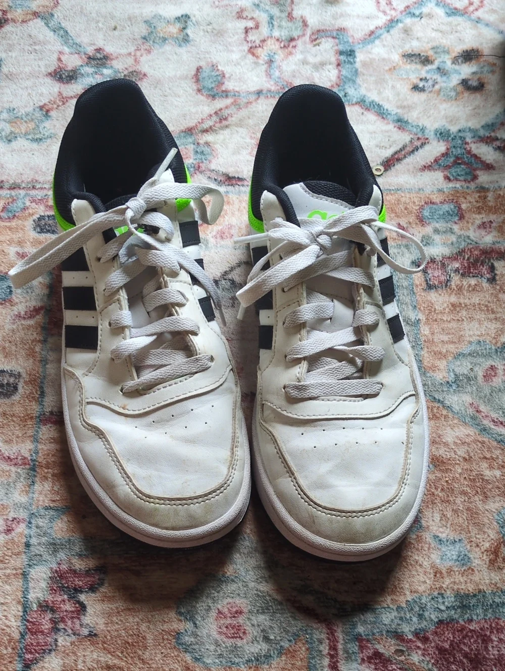 White Adidas Sneakers with Black Stripes and Neon Green Accent